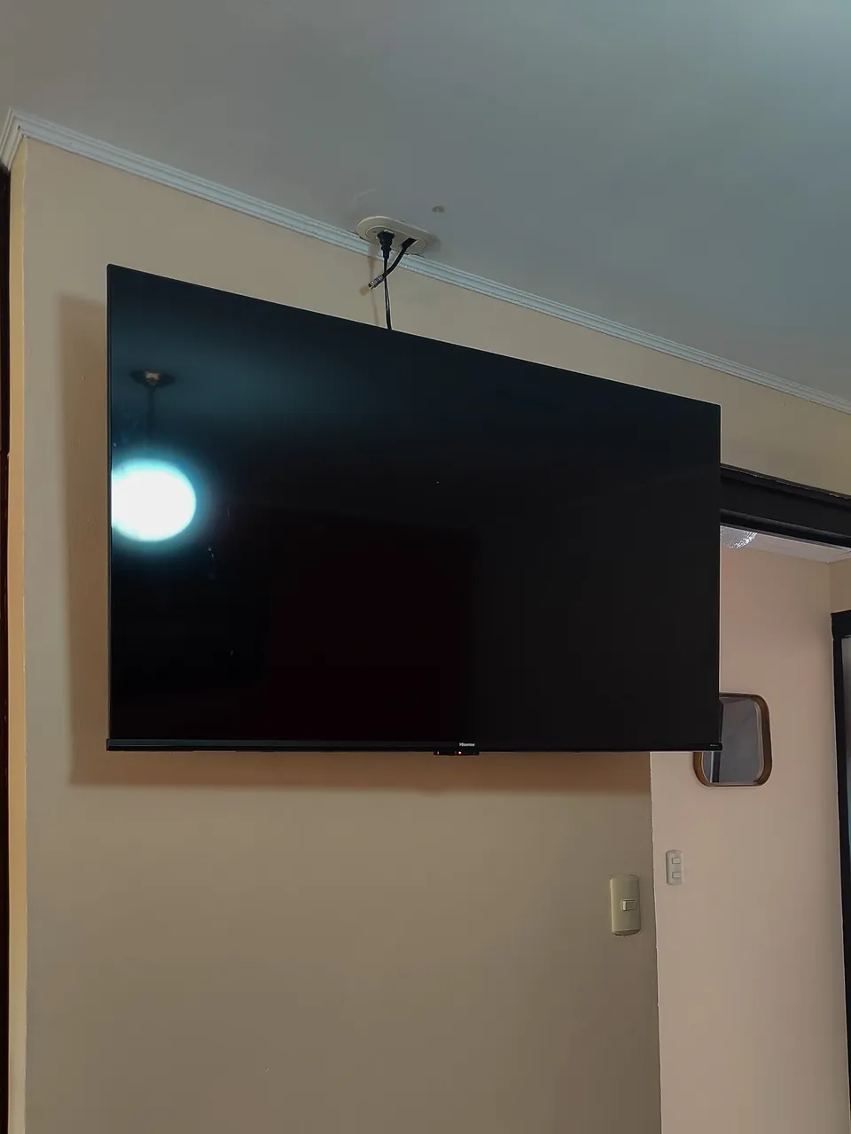 Instalación de televisor con soporte en pared